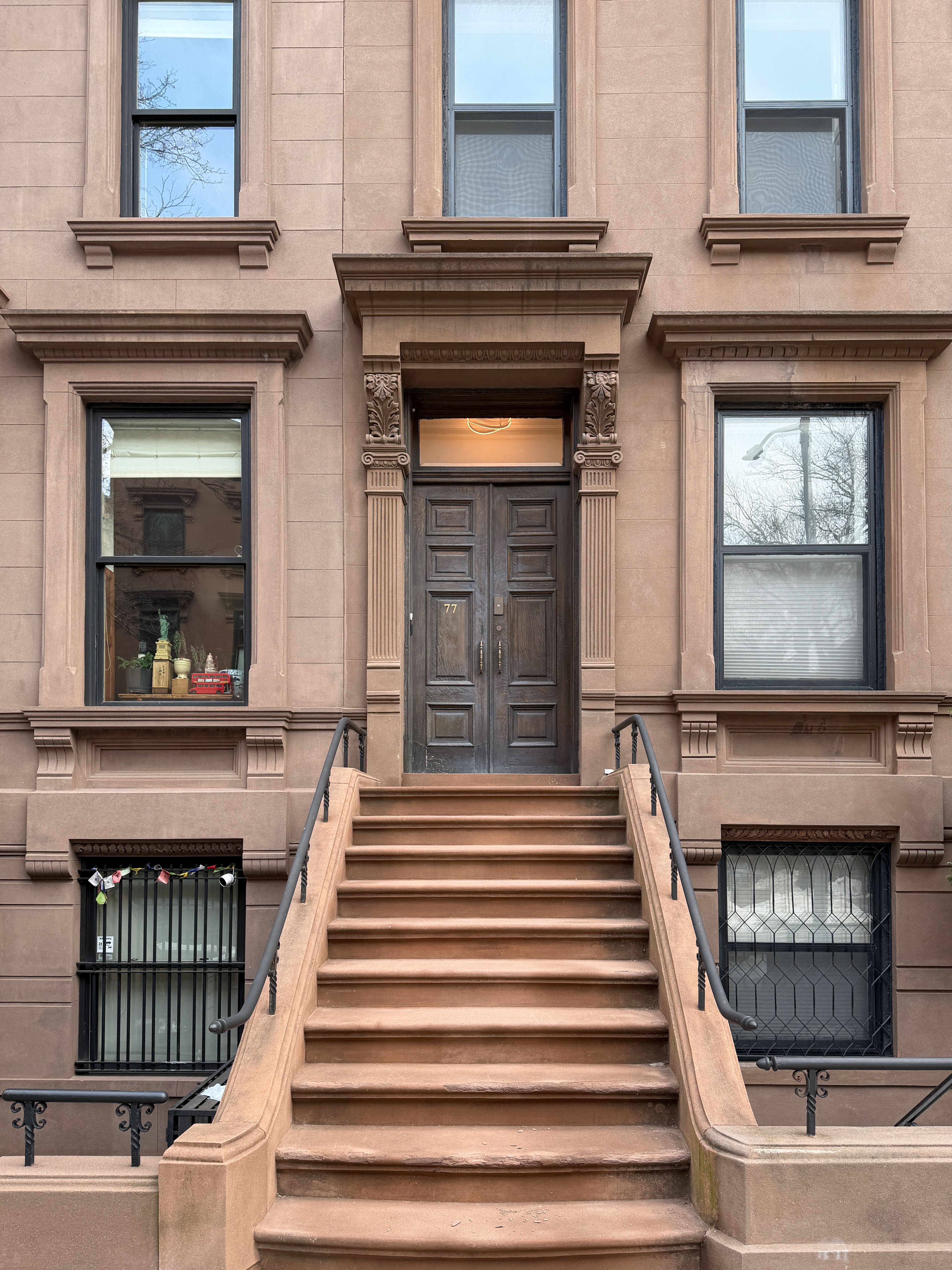 Stone steps leading to a brownstone door